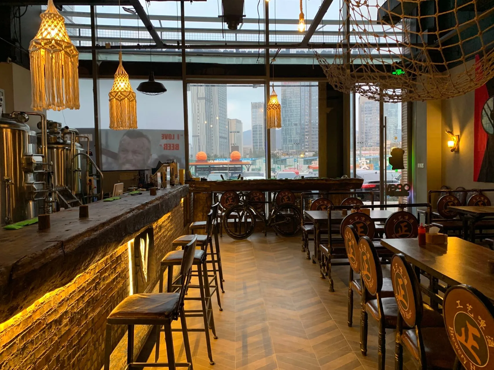 A busy craft-beer bar heated by wall elements behind the plaster