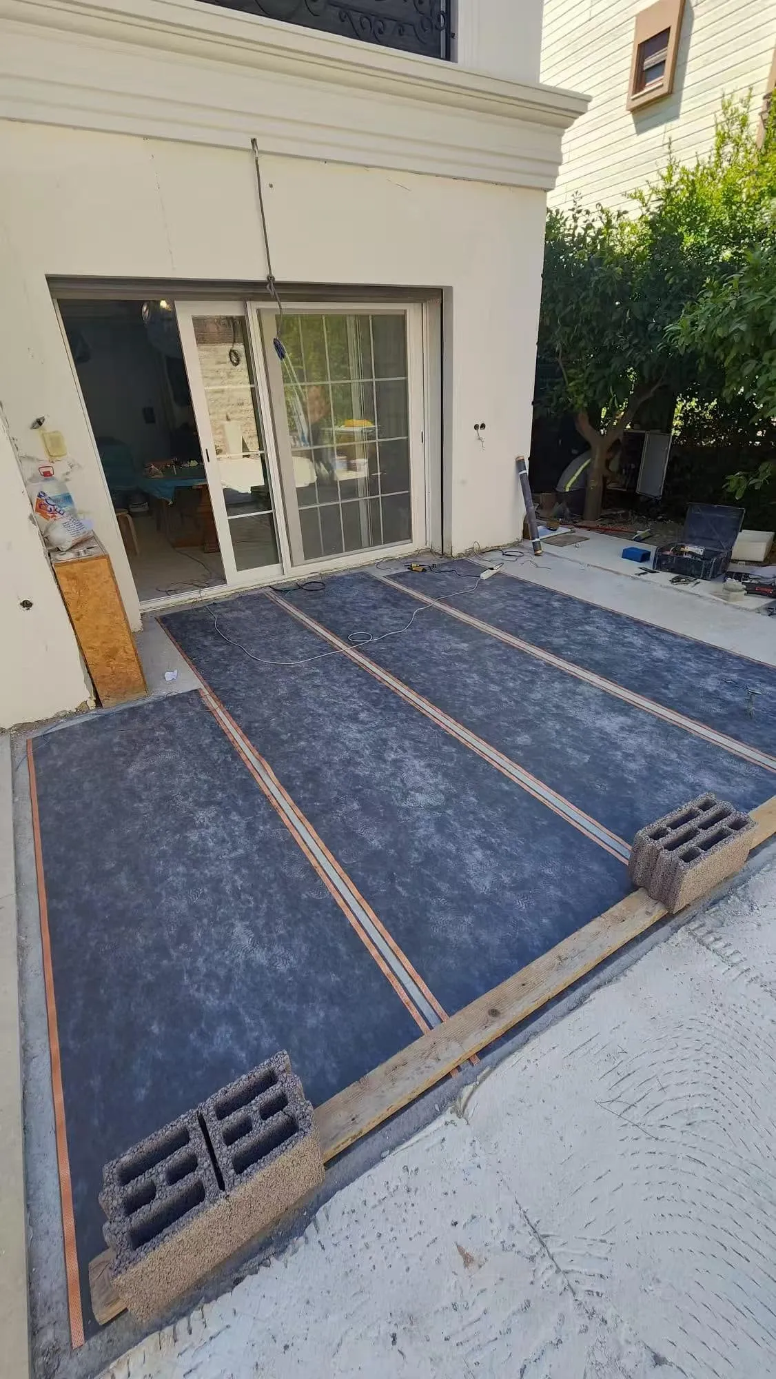 SafeTech EGS with copper bus bars laid across a terrace floor before the screed