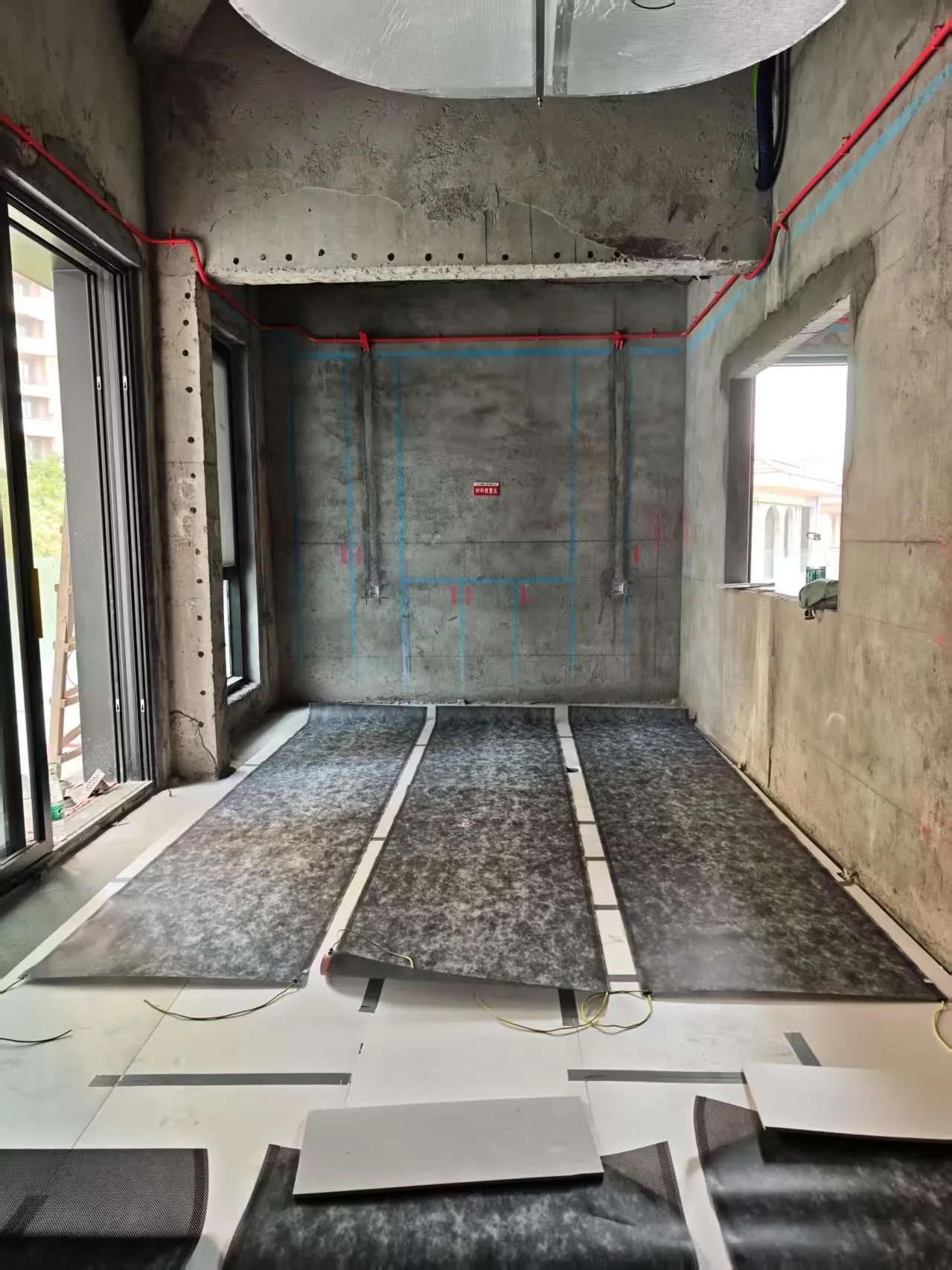 ComfortScrim laid across a villa floor before the levelling compound