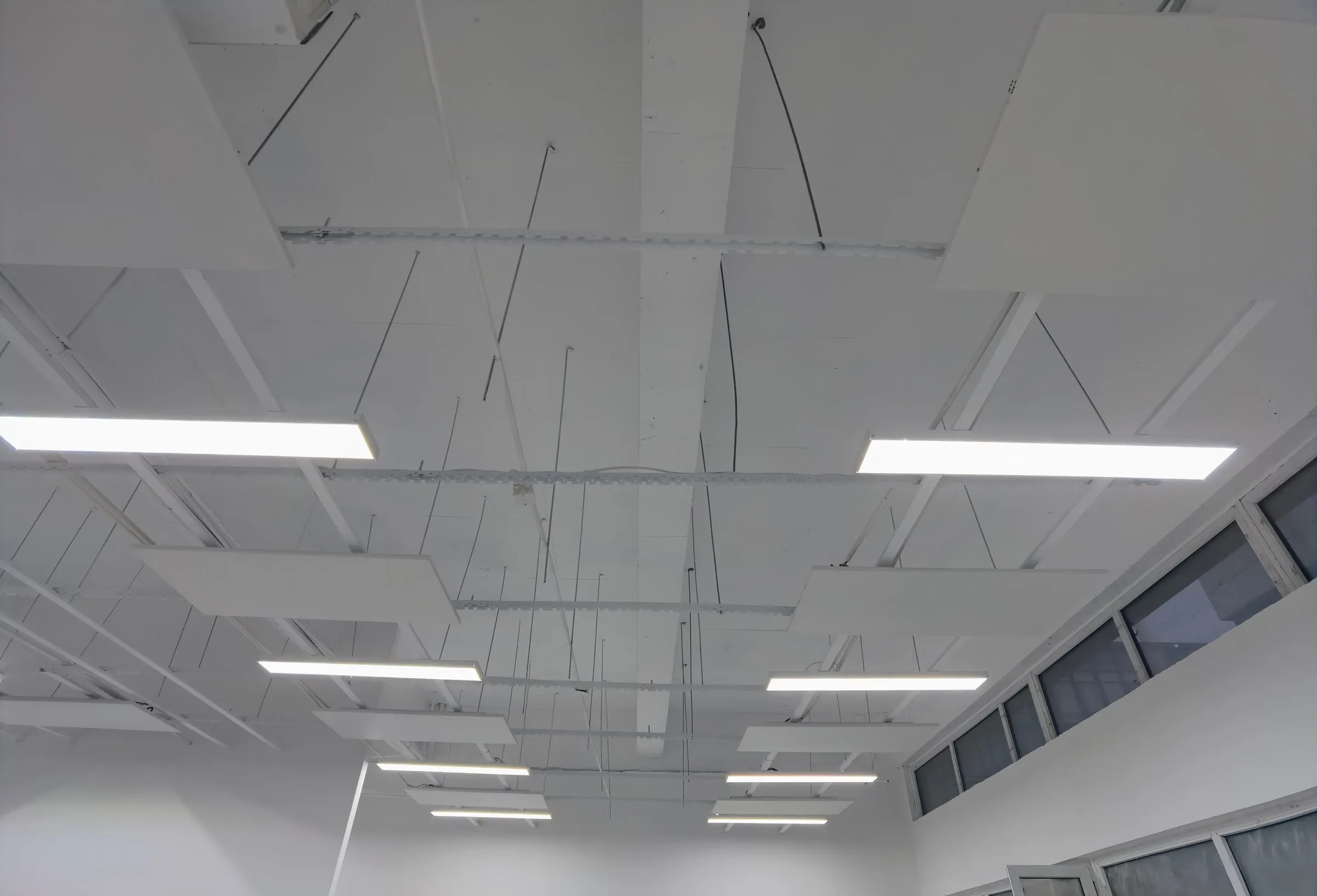 A finished ceiling with heating panels concealed above the plaster